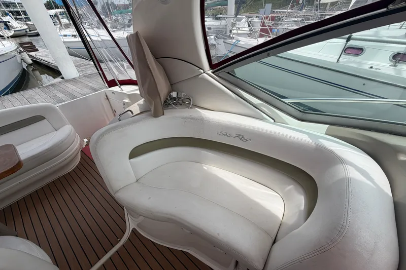 Slide: The Image of Interior seating of a 2006 Sea Ray Sundancer 320 yacht at a marina. - 13