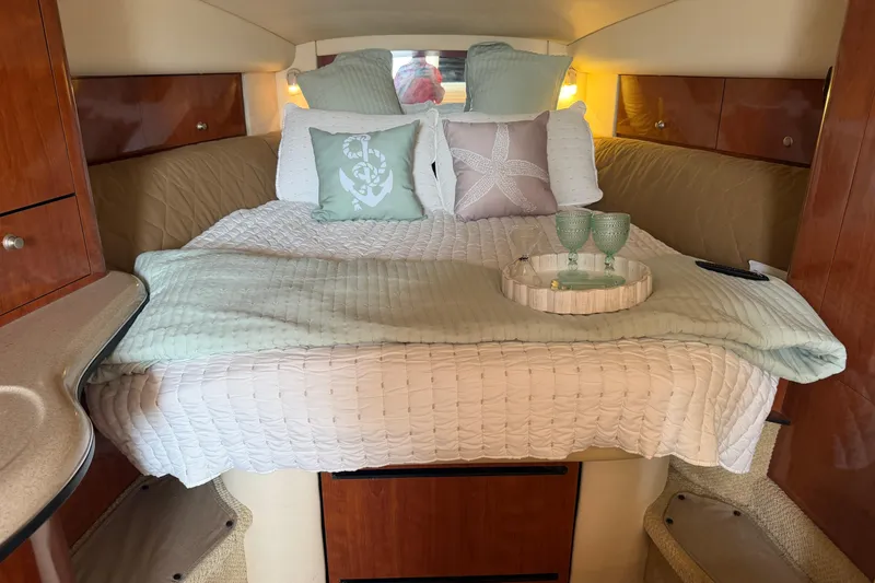 Slide: The Image of Luxurious cabin interior of 2006 Sea Ray Sundancer 320 with cozy bedding and decor. - 15
