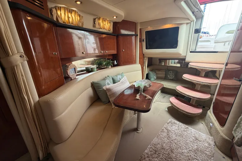 Slide: The Image of Luxurious interior of 2006 Sea Ray Sundancer 320 yacht with plush seating and elegant wood finishes. - 17