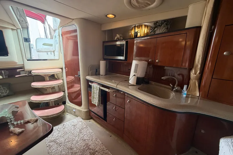 Slide: The Image of Luxurious interior of a 2006 Sea Ray Sundancer 320 yacht with elegant wood cabinetry. - 18