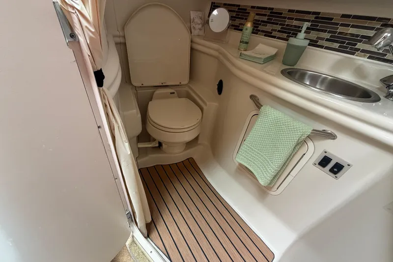 Slide: The Image of Bathroom interior of 2006 Sea Ray Sundancer 320 yacht with toilet and sink. - 21