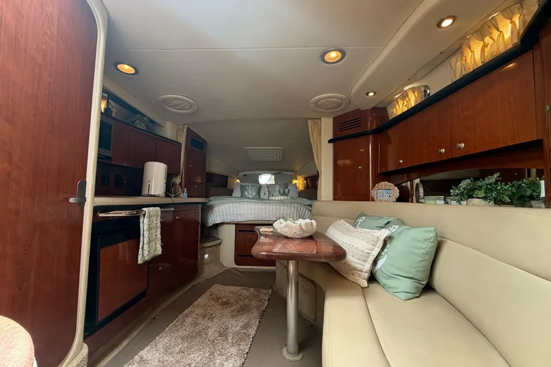 Slide: The Image of Interior of 2006 Sea Ray Sundancer 320 yacht with cozy seating and elegant wood finishes. - 24