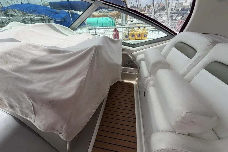 Slide: The Image of Interior of 2006 Sea Ray Sundancer 320 with covered seating and wooden flooring. - 8