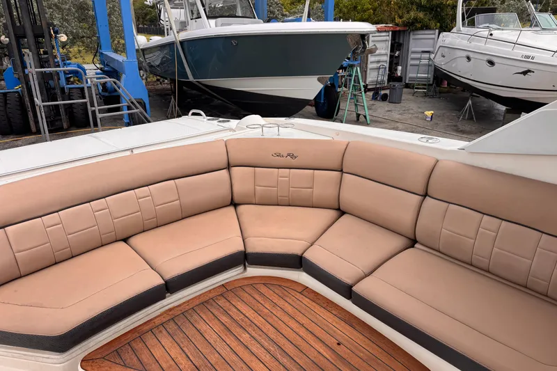 Slide: The Image of Luxurious seating on a 2016 Sea Ray SLX 350 boat with teak flooring. - 13