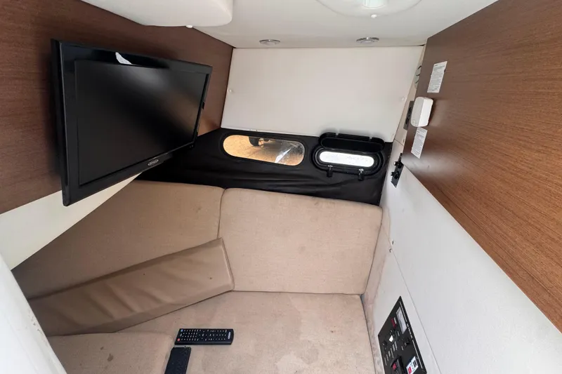 Slide: The Image of Interior cabin of 2016 Sea Ray SLX 350 with TV and seating area. - 20