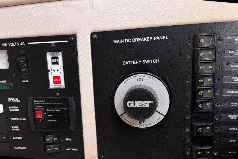 Slide: The Image of Control panel of a 2016 Sea Ray SLX 350 boat with battery switch and breakers. - 21