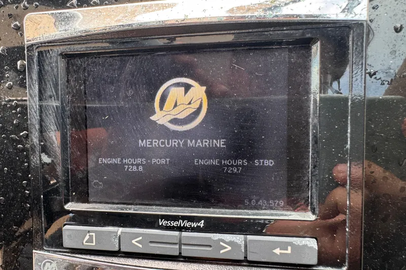 Slide: The Image of Mercury Marine display on 2016 Sea Ray SLX 350 showing engine hours. - 24