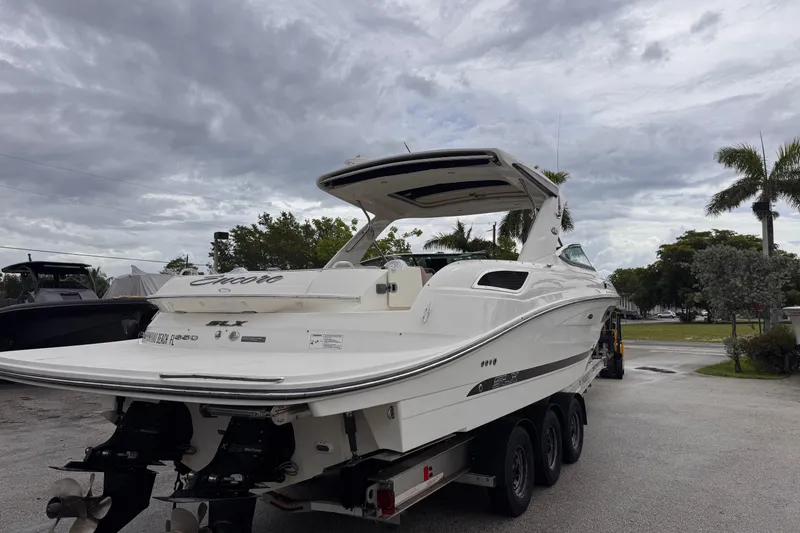 Slide: The Image of 2016 Sea Ray SLX 350 boat on trailer under cloudy sky. - 7