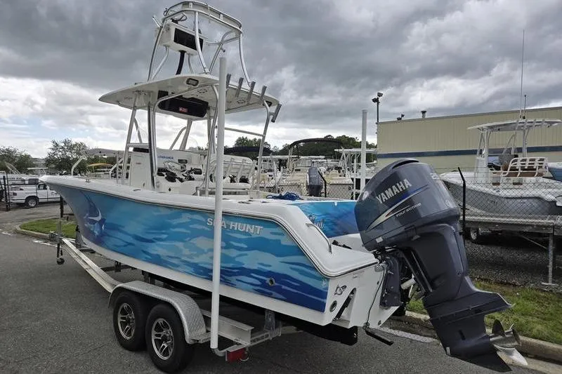 Slide: The Image of 2011 Sea Hunt Triton 240 boat with Yamaha outboard motor on trailer. - 10
