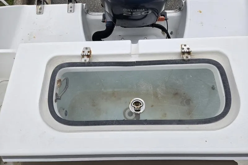 Slide: The Image of Livewell on 2011 Sea Hunt Triton 240 boat with Yamaha 250 engine. - 18