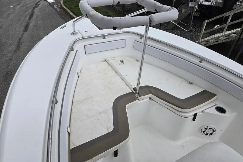 Slide: The Image of 2011 Sea Hunt Triton 240 boat interior with cushioned seating and storage compartments. - 3