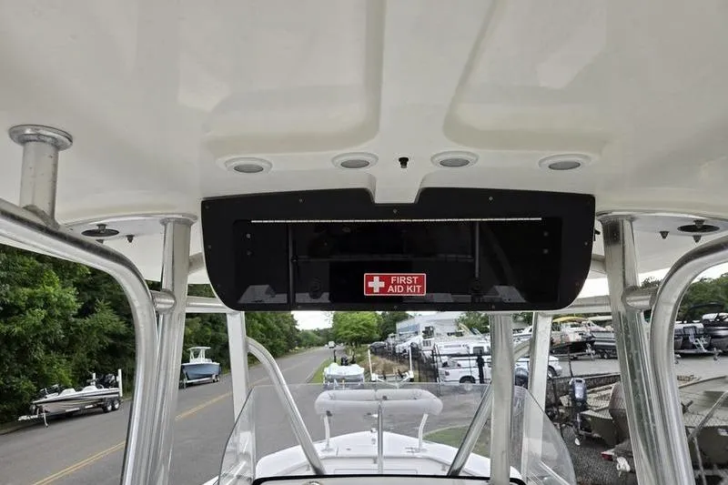 Slide: The Image of 2011 Sea Hunt Triton 240 boat interior with first aid kit visible. - 4