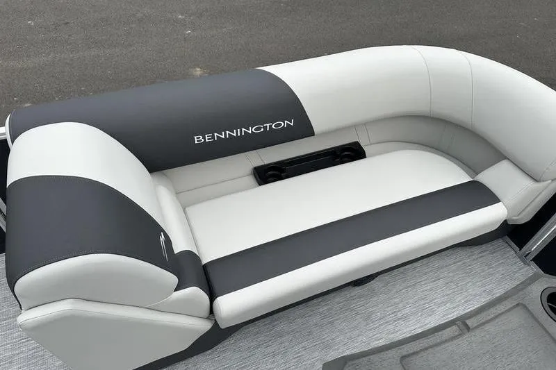 Slide: The Image of 2026 Bennington S Swingback 22 SSB boat seating, featuring sleek black and white upholstery. - 11