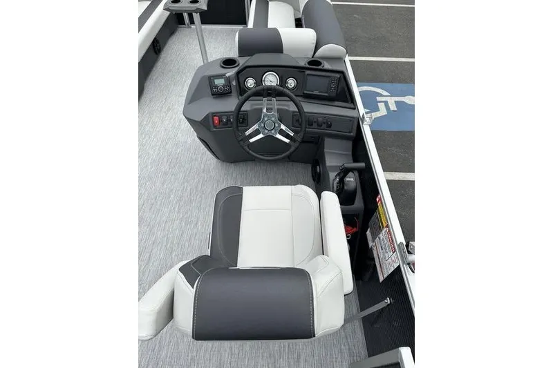 Slide: The Image of 2026 Bennington S Swingback 22 SSB boat interior with steering wheel and seating. - 14