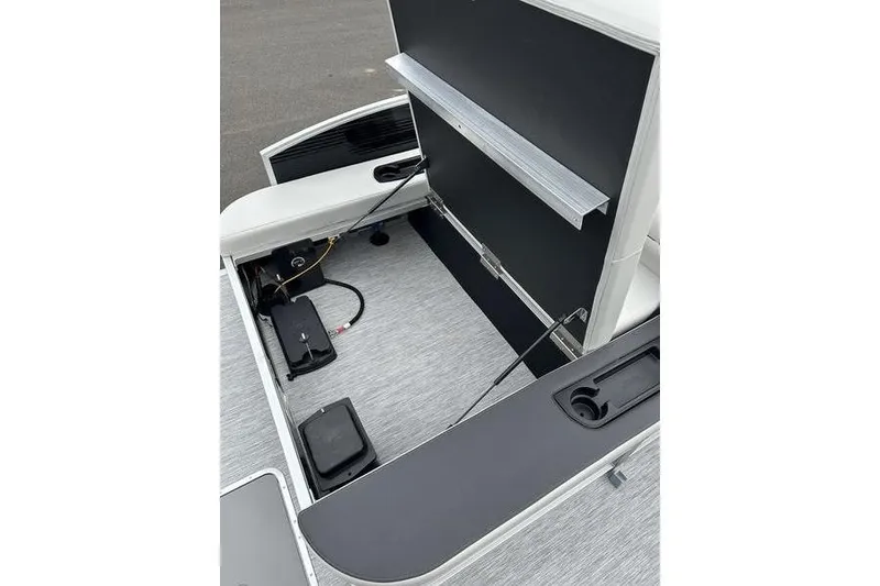 Slide: The Image of 2026 Bennington S Swingback 22 SSB boat interior with storage compartments and seating. - 9