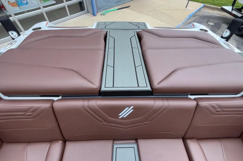 Slide: The Image of 2026 ATX Surf Boats 24 Type-S interior with brown leather seating and sleek design. - 12