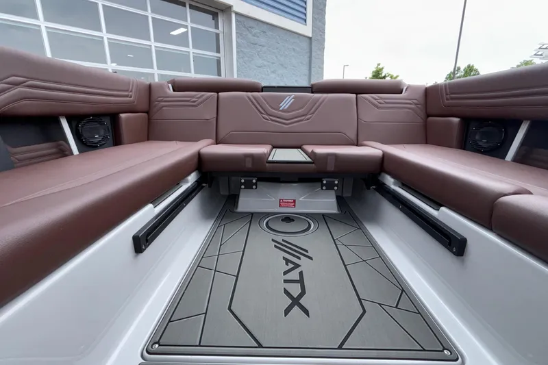 Slide: The Image of Interior of 2026 ATX Surf Boats 24 Type-S with brown seating and branded flooring. - 18