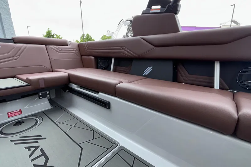 Slide: The Image of Luxurious interior seating of 2026 ATX Surf Boats 24 Type-S with brown upholstery. - 19