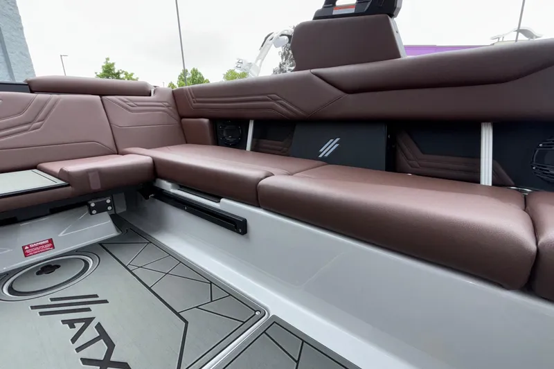 Slide: The Image of 2026 ATX Surf Boats 24 Type-S interior with brown seating and modern design. - 20