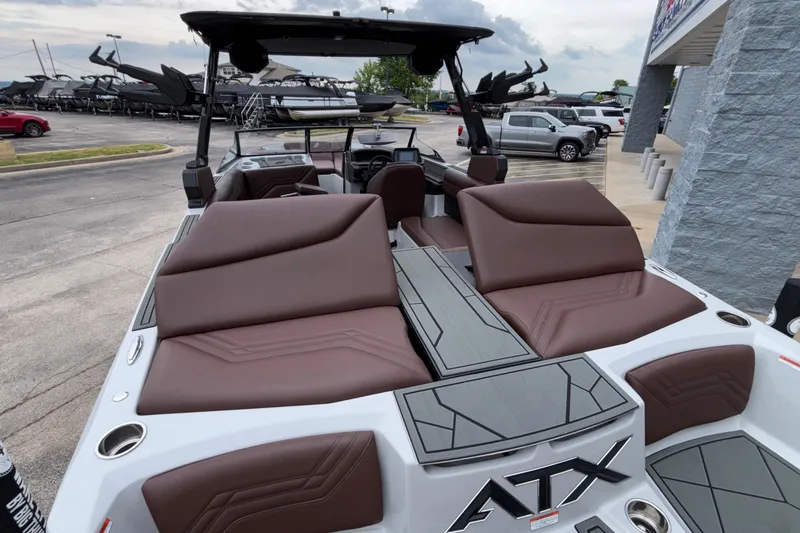 Slide: The Image of 2026 ATX Surf Boats 24 Type-S with brown seating, parked outdoors. - 22