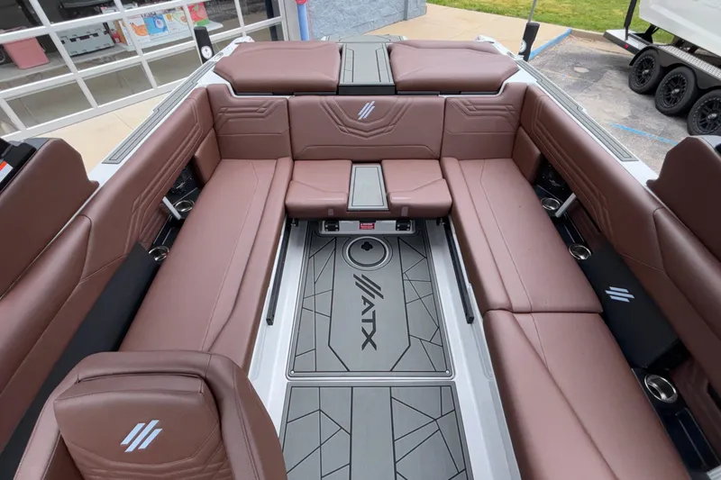 Slide: The Image of Luxurious interior of 2026 ATX Surf Boats 24 Type-S with brown seating and modern design. - 27