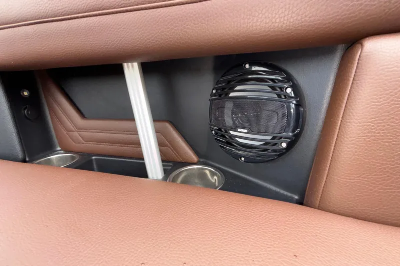 Slide: The Image of 2026 ATX Surf Boats 24 Type-S interior with brown leather seats and speaker system. - 30