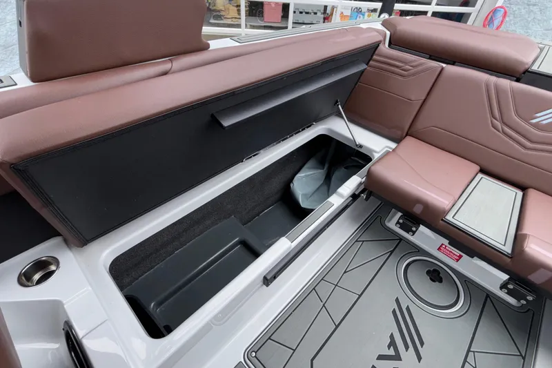 Slide: The Image of 2026 ATX Surf Boats 24 Type-S interior seating with storage compartment open. - 31