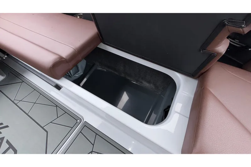Slide: The Image of 2026 ATX Surf Boats 24 Type-S interior storage compartment with brown seating. - 33