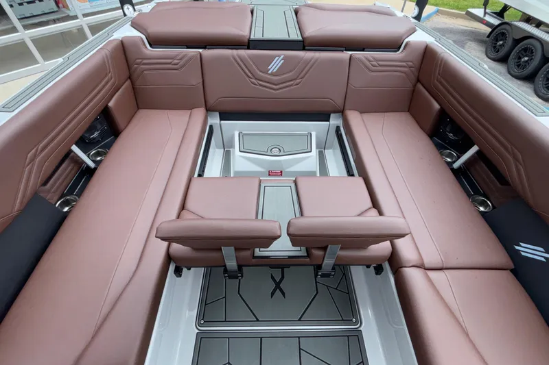 Slide: The Image of Luxurious interior of 2026 ATX Surf Boats 24 Type-S with brown leather seating. - 34