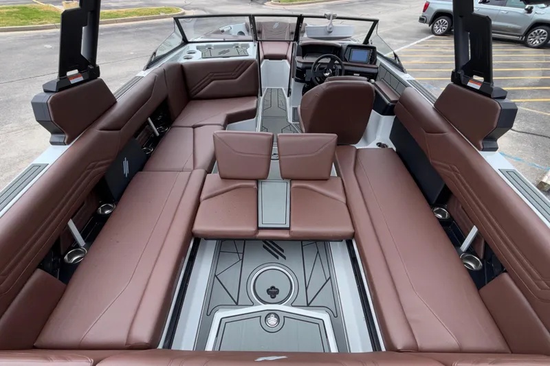 Slide: The Image of 2026 ATX Surf Boats 24 Type-S interior with brown seating and modern dashboard. - 35