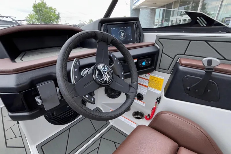 Slide: The Image of 2026 ATX Surf Boats 24 Type-S dashboard with steering wheel and digital display. - 37