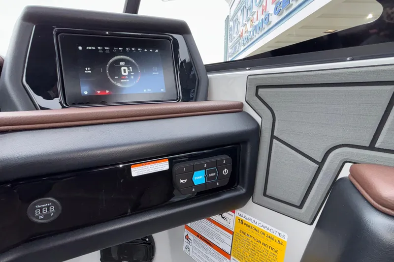 Slide: The Image of 2026 ATX Surf Boats 24 Type-S dashboard with digital display and control panel. - 40