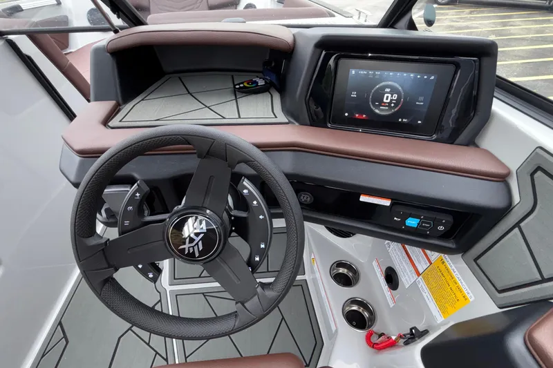 Slide: The Image of 2026 ATX Surf Boats 24 Type-S dashboard with steering wheel and touchscreen display. - 43