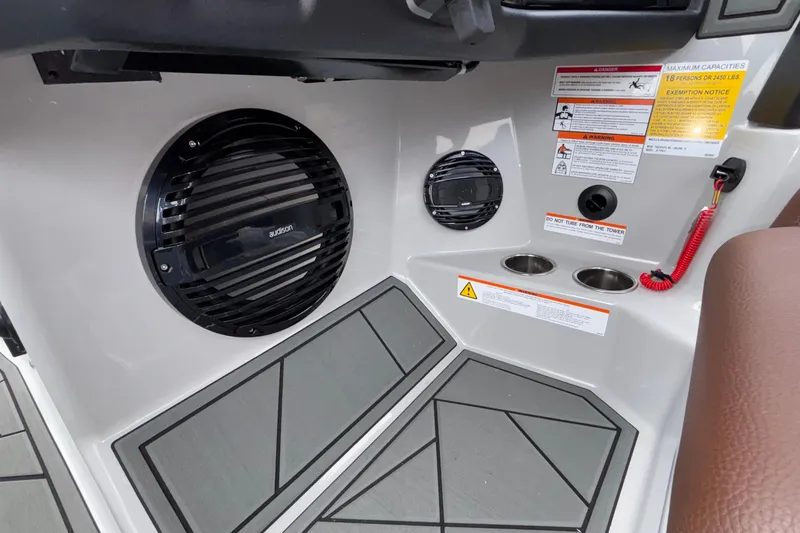 Slide: The Image of Interior of 2026 ATX Surf Boats 24 Type-S with speakers and safety labels. - 45