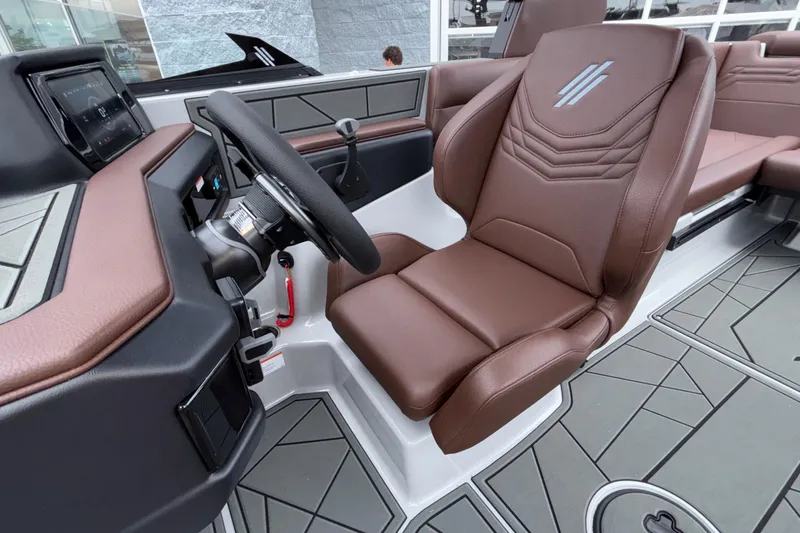 Slide: The Image of Interior of 2026 ATX Surf Boats 24 Type-S, featuring brown leather seating and modern dashboard. - 46
