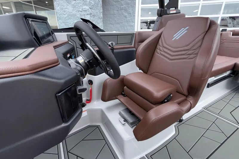 Slide: The Image of 2026 ATX Surf Boats 24 Type-S cockpit with brown leather seating and modern dashboard. - 47