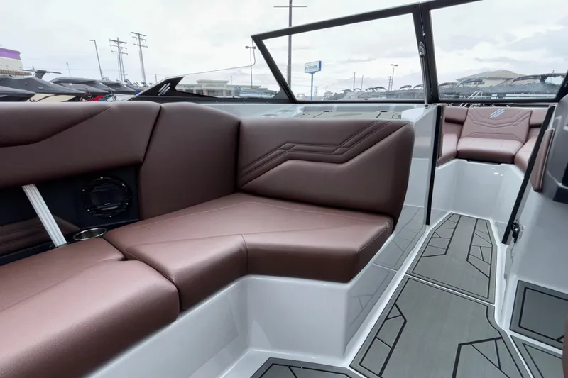Slide: The Image of Luxurious interior of 2026 ATX Surf Boats 24 Type-S with brown seating and modern design. - 48
