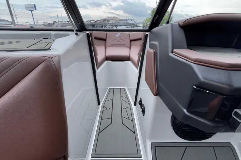 Slide: The Image of Interior view of 2026 ATX Surf Boats 24 Type-S with brown seating and modern design. - 53