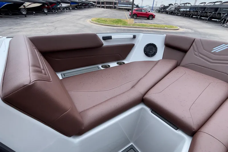 Slide: The Image of 2026 ATX Surf Boats 24 Type-S interior with brown seating and speaker. - 54