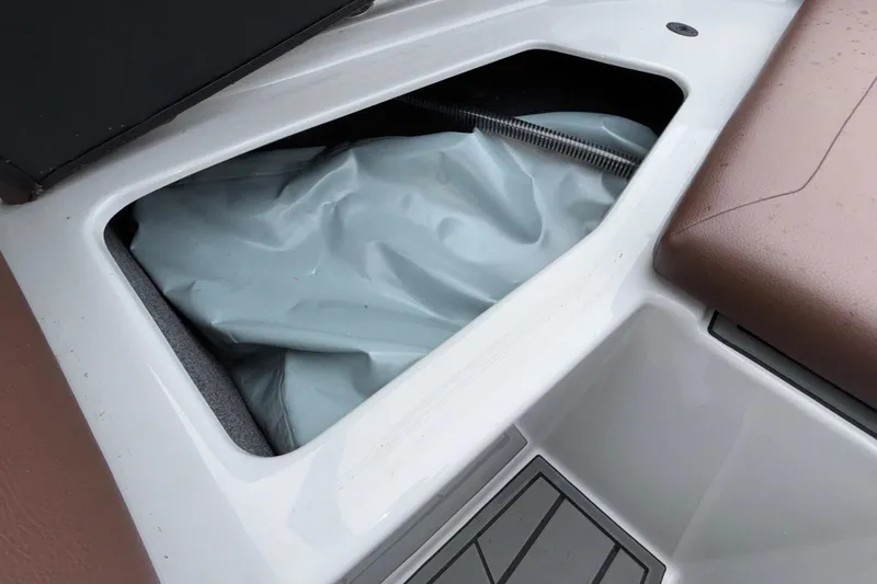Slide: The Image of Storage compartment of 2026 ATX Surf Boats 24 Type-S, featuring interior details. - 56