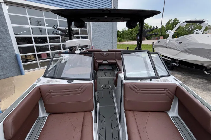 Slide: The Image of 2026 ATX Surf Boats 24 Type-S interior with brown seating and sleek design. - 59