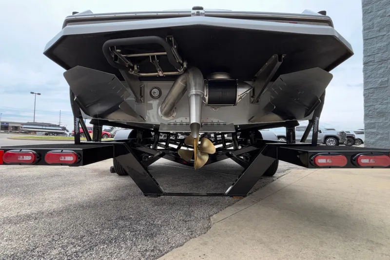 Slide: The Image of Rear view of 2026 ATX Surf Boats 24 Type-S on trailer, showcasing propeller and hull design. - 61