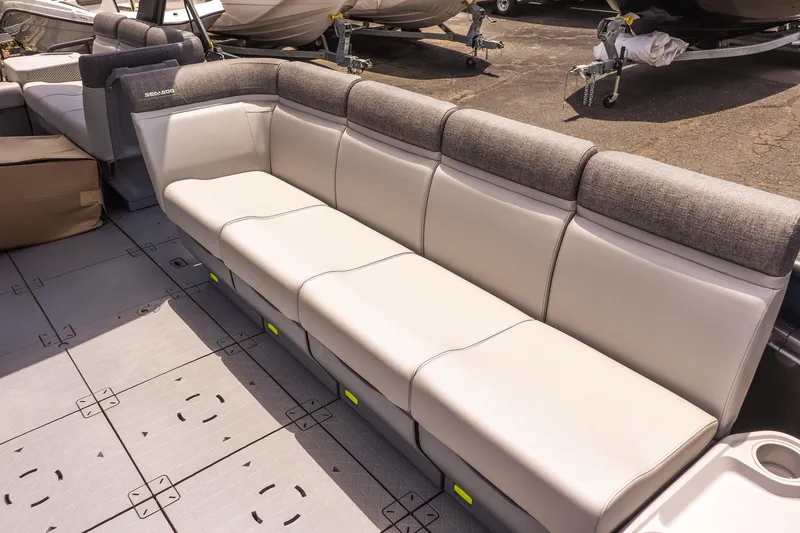 Slide: The Image of 2026 Sea-Doo Switch Cruise 21 interior seating with gray and white upholstery. - 10