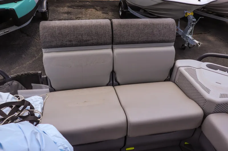 Slide: The Image of 2026 Sea-Doo Switch Cruise 21 interior seating with gray upholstery and storage compartments. - 14