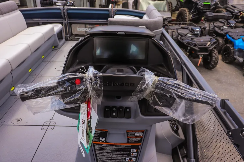 Slide: The Image of 2026 Sea-Doo Switch Cruise 21 dashboard with controls and display, wrapped in protective plastic. - 15