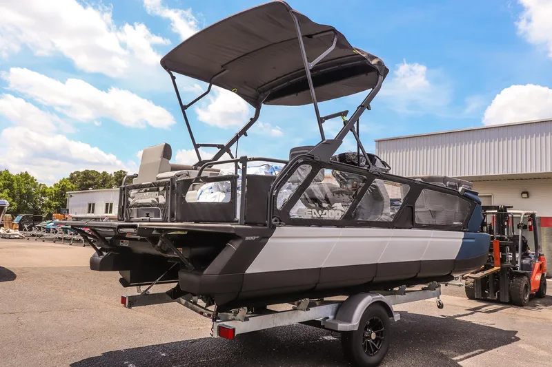 Slide: The Image of 2026 Sea-Doo Switch Cruise 21 pontoon boat on trailer, outdoor display. - 3