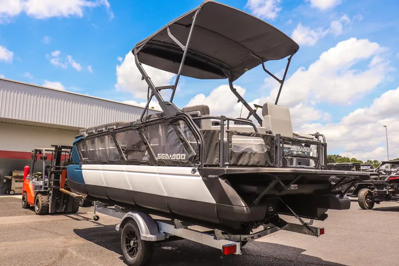 Slide: The Image of 2026 Sea-Doo Switch Cruise 21 pontoon boat on trailer, outdoor display. - 5