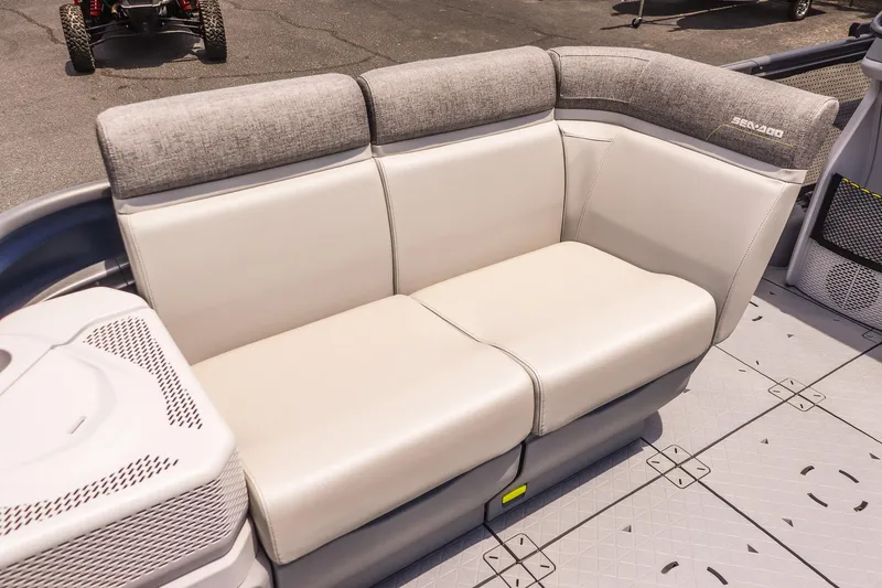 Slide: The Image of 2026 Sea-Doo Switch Cruise 21 interior seating with gray and white upholstery. - 9