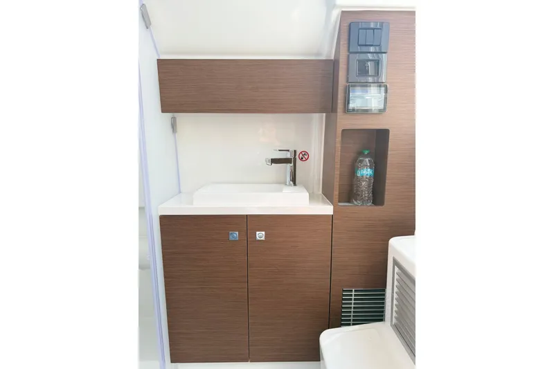 Slide: The Image of Modern bathroom interior of 2026 Wellcraft 38 T-Top boat with wooden cabinetry. - 10