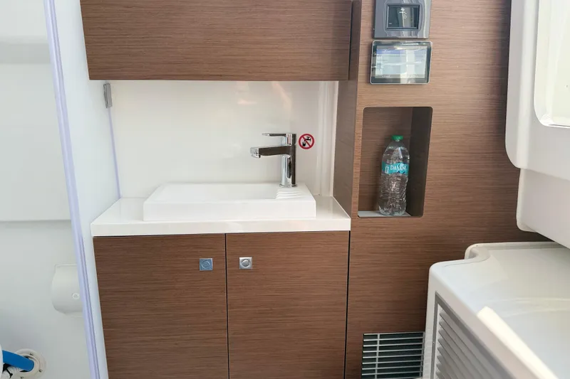Slide: The Image of Modern sink area in 2026 Wellcraft 38 T-Top boat interior. - 11